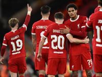 Liverpool's Portuguese striker #20 Diogo Jota (C) celebrates with teammates after scoring their second goal during the UEFA Europa League group E football match between Liverpool and Royale Union Saint-Gilloise at Anfield in Liverpool, north west England on October 5, 2023. Liverpool won the game 2-0. (Photo by Oli SCARFF / AFP)