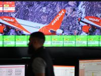 Members of staff work on computers in the Network Control Room inside Easyjet's new operations Integrated Control Centre (ICC) in Luton, north of London on May 22, 2024. A cutting-edge facility featuring artificial intelligence (AI) -- Easyjet's new control centre is tasked with handling about 2,000 mostly-European flights per day as the British airline eyes record summer demand. (Photo by Justin TALLIS / AFP)