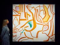 Art handlers hold a painting by Willem De Kooning 'Untitled XVIII', estimate: £4,000,000 6,000,000, from the collection of Eric Clapton during a photocall at Christie's auction house ahead of the 20th/21st Century Evening Sale in London, United Kingdom on October 03, 2024. (.photo by afp)