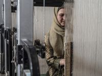 Afghan women weave carpets at a factory on the outskirts of Kabul. Many women have launched small businesses in the past three years to meet their own needs and support other Afghan women (Photo by AFP)
