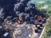 Massive fire destroys five factories in Malaysia, oil spill suspected