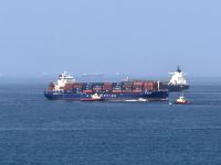 Foreign cargo ship runs aground in Strait of Hormuz as Iran defends shipping controls
