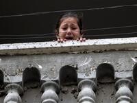 A relative of 29-year-old Saadi Abu Taha, who was killed at the Israel-Gaza border during protests, mourns while looking out of a balcony in Khan Yunis in the southern Gaza strip on Apr. 21, 2018.
SAID KHATIB / AFP