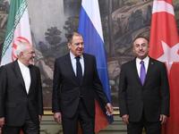 Russian Foreign Minister Sergei Lavrov (C), his Turkish counterpart Mevlut Cavusoglu (R) and Iran's Foreign Minister Mohammad Javad Zarif pose for pictures prior to their meeting in Moscow on April 28, 2018. Alexander NEMENOV / AFP