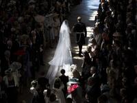 Britain's Prince Harry, Duke of Sussex (R) and Britain's Meghan Markle, Duchess of Sussex, (L) walk away from the High Altar toward the West Door at the end of their wedding ceremony in St George's Chapel, Windsor Castle, in Windsor, on May 19, 2018. 
Danny Lawson/ AFP
