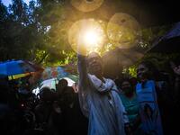 Indian members and supporters of the lesbian, gay, bisexual, transgender (LGBT) community celebrate the Supreme Court decision to strike down a colonial-era ban on gay sex, during heavy rainfall in New Delhi on September 6, 2018. 
CHANDAN KHANNA / AFP