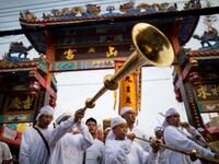 Devotees of the Loem Hu Thai Su shrine parade during the annual Vegetarian Festival in Phuket on October 12, 2018. Jewel SAMAD/AFP