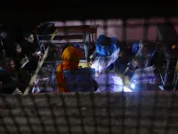 In this photo taken on October 20, 2018, Afghan Independent Election Commission (IEC) officials count ballot papers at a polling centre for the country's legislative election in Herat province. 
HOSHANG HASHIMI / AFP