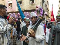 Young Moroccans take part in the Boujloud festival, a popular festival also known as the 'Moroccan Halloween' in the Sidi Moussa district of Sale near Rabat, on October 27, 2018. 
FADEL SENNA / AFP