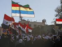 Druze men protest against municipal elections in front of a polling centre in the village of Majdal Shams in the Israeli-annexed Golan Heights on October 30, 2018. (JALAA MAREY / AFP)
