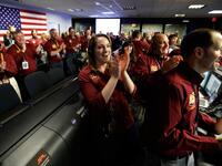 NASA engineers react after the successful landing by the InSight spacecraft on the planet Mars from California. 
Al SEIB / POOL / AFP