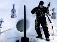 US artist Tim Linhart works on an ice violin in the "Ice Dome" on Presena Galcier, Tonale Pass, near Trento in northern Italy on January 18, 2018.
Marco BERTORELLO / AFP