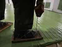A Syrian worker cuts olive soap bars in a factory on the outskirts of Aleppo 
LOUAI BESHARA / AFP