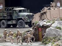 Members fo the UAE Armed forces perform a military drill during the opening of the International Defence Exhibtion and Confrence at the Abu Dhabi National Exhibtion Centre on February 17, 2019. 
AFP