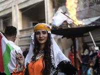 Kurds dressed in traditional outfits celebrate Nowruz (Noruz) in the Kurdish-controlled city of Qamishly in northeastern Syria on March 20, 2019.
Delil SOULEIMAN / AFP