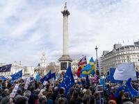 People hold up placards and European Union flags as they pass Trafalgar Square on a march and rally organised by the pro-European People's Vote campaign for a second EU referendum in central London on March 23, 2019.
Niklas HALLE'N / AFP