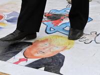 Syrians protest in the northern city of Aleppo against the US' decision to recognise Israel's sovereignty over the Golan Heights on March 26, 2019. 
George OURFALIAN / AFP