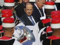 Lebanese President Michel Aoun reviews the honour guard upon his arrival at Tunis-Carthage international airport on March 30, 2019, to attend the Arab Summit tomorrow. 
Hussein Malla / POOL / AFP