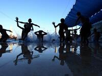 Palestinian children jump into a swimming pool in the village of Hawara, near the West Bank city of Nablus, on August 9, 2013, a day after Eid al-Fitr celebrations following the Islamic holy month of Ramadan. (AFP)