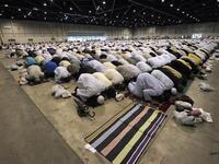 Faithfuls pray during the Eid al-Fitr ceremony in Marseille, southern France, on August 8, 2013. (AFP)
