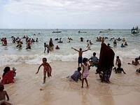 Muslims are pictured at Bamburi Public beach in the coastal city of Mombasa, Kenya on August 9, 2013. (AFP)
