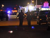 Police vehicles block the road to Marjory Stoneman Douglas High School in Parkland, Florida, following a shooting that killed 17 people on Feb. 14, 2018 in Parkland, Florida. (Gaston De Cardenas / AFP)