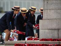 School children lay wreaths during a Remembrance Day ceremony honouring members of the armed forces who died in the line of duty at the Cenotaph marking the 100th anniversary of the end of World War I in Hong Kong on November 11, 2018. 
VIVEK PRAKASH / AFP