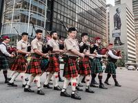 Pipers part of a military orchestra take part in a Sunset Parade in Durban, on November 11, 2018 as part of commemorations marking the 100th anniversary of the 11 November 1918 armistice, ending World War I. 
RAJESH JANTILAL / AFP
