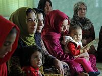 Women and young girls listen to Rasul, an Iraqi Kurdish activist with the non-profit organisation WADI, as she peaks about the harms of genital mutilation in Sharboty Saghira, a small village east of regional capital Arbil.
SAFIN HAMED / AFP