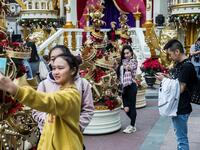 People take photos in front of Christmas decorations on display in the Kowloon district of Hong Kong on December 16, 2018. 
ISAAC LAWRENCE / AFP