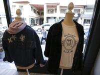 This picture shows clothing from the Palestinian feminist fashion label "BabyFist" on display at a shop in Ramallah in the occupied West Bank. 
ABBAS MOMANI / AFP