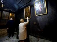 Christian worshippers pray inside the Grotto, believed to be the exact spot where Jesus Christ was born, at the Church of the Nativity in the biblical West Bank city of Bethlehem, on December 22, 2018, three days ahead of the Christmas celebration. Musa Al Shaer/AFP
