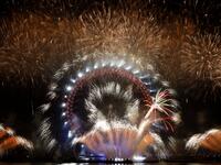 Fireworks explode around the London Eye during New Year's celebrations in central London just after midnight on January 1, 2019. 
ADRIAN DENNIS / AFP