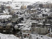 Village of Sofar, some 30 kilometres (20 miles) east of the Lebanese capital Beirut on January 7, 2019, shows a neighbouring village covered in snow as a fierce winter storm lashed the east coast of the Mediterranean. 
JOSEPH EID / AFP