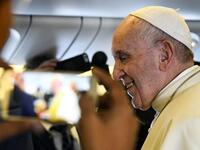 Pope Francis arrives to speak to reporters aboard a plane on his way to Abu Dhabi on February 3, 2019. 
Vincenzo PINTO / AFP