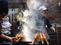 Pakistani workers dye fabric threads at a factory in Lahore 
ARIF ALI / AFP