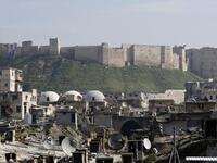A general view shows the Saqatiya market, during restoration, and the Citadel of Aleppo, in the old quarter of Syria's second city of Aleppo 
LOUAI BESHARA / AFP