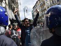 Members of the security forces stand guard as Algerian students protest in the capital Algiers against ailing President Abdelaziz Bouteflika's bid for a fifth term
RYAD KRAMDI / AFP