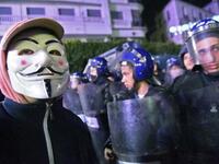 Algerian police stand guard during a demonstration in the capital Algiers against ailing President Abdelaziz Bouteflika's bid for a fifth term
RYAD KRAMDI / AFP