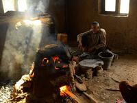 An Afghan man works at a factory which produces traditional glassware handicrafts in Herat (AFP)