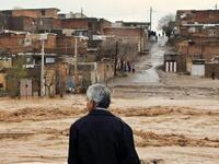 An Iranian man looking at the flooded street in a village around the city of Ahvaz, in Iran's Khuzestan province (Twitter)