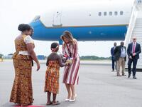 US First Lady Melania Trump receives flowers during an arrival ceremony after landing at Kotoka International Airport in Accra October 2, 2018 as she begins her week long trip to Africa to promote her 'Be Best' campaign.  (SAUL LOEB / AFP)