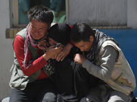 Afghan residents weeps for their relatives outside the Istiqlal Hospital in Kabul following the attack. (AFP)