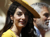 Amal was born into the Islamic faith, but remains private about the current status of said faith