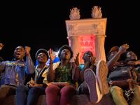 Nigerian football fans react as they watch the Russia 2018 World Cup Group D football match between Croatia and Nigeria on a giant screen at the official FIFA Fan Fest in Volgograd on June 16, 2018. 
NICOLAS ASFOURI / AFP