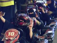A Saudi woman takes selfi as she uses a go-cart during a driving workshop for women in the Saudi capital Riyadh on June 21, 2018. 
FAYEZ NURELDINE / AFP