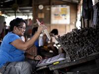 A worker makes fireworks for New Year celebrations in Bocaue, Bulacan, north of Manila on December 26, 2018. 
Noel CELIS / AFP