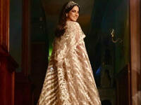 Tunisian beauty Dorra put on a cape dress designed by Egyptian designer Hany Elbehairy in Nassr Al Said Said's Eagle series 