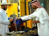 KSA: A Saudi man buys incense outside a shop at the Mecca market in central Riyadh in readiness for Eid, 
the holiday following Ramadan. Traditional spicy scents are prevalent, as people enjoy the setting the mood, and marking
the festive flavor of the occasion.