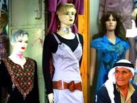 Palestinian preparations: In the West Bank city of Hebron, following universal Eid custom, Muslims buy new clothes for Eid. Often they can use their 'Eidiyeh' (the money gifts traditionally bestowed upon child members of the family - especially from grandparents) to buy new clothes or treats.